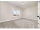 An inviting bedroom is carpeted and has natural lighting through the window at 267 Triple Ponds Ct # 11, Clover, SC 29710