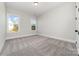 Bright bedroom with neutral walls, carpet flooring, and two windows for lots of light at 267 Triple Ponds Ct # 11, Clover, SC 29710