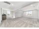 Large bonus room featuring neutral carpets, natural light, and a wet bar at 267 Triple Ponds Ct # 11, Clover, SC 29710