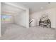 Spacious bonus room featuring neutral carpets, natural light, and plenty of space at 267 Triple Ponds Ct # 11, Clover, SC 29710