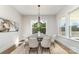 Bright dining room with large windows, hardwood floors, and stylish furniture at 267 Triple Ponds Ct # 11, Clover, SC 29710