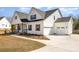 Beautiful home with a three-car garage and a sidewalk leading to the front door at 267 Triple Ponds Ct # 11, Clover, SC 29710