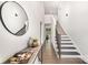 Bright hallway featuring stairs, hardwood floors, a table with decor, and a large mirror at 267 Triple Ponds Ct # 11, Clover, SC 29710