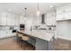 Bright kitchen features white cabinets, subway tile backsplash, stainless steel appliances, and granite countertops at 267 Triple Ponds Ct # 11, Clover, SC 29710