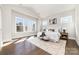 Airy main bedroom featuring large windows, hardwood floors, and a luxurious rug at 267 Triple Ponds Ct # 11, Clover, SC 29710