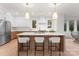 Modern kitchen with island, stainless steel appliances, and light wood cabinets at 2911 Hilliard Dr, Charlotte, NC 28205