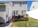 Private backyard featuring a small patio with outdoor seating, a storage shed, and plenty of green space at 3000 Misty Harbor Cir # F, Cramerton, NC 28032