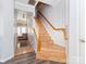 Inviting entryway features a staircase with wood railings and luxury vinyl plank flooring at 3000 Misty Harbor Cir # F, Cramerton, NC 28032