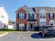 Inviting townhome with brick facade, black shutters, and a welcoming front porch in a well-maintained community at 3000 Misty Harbor Cir # F, Cramerton, NC 28032