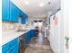 Well-lit kitchen with blue cabinets, stainless steel dishwasher, and eat in nook at 3000 Misty Harbor Cir # F, Cramerton, NC 28032