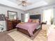 Spacious main bedroom with neutral tones, tray ceiling, plenty of natural light, and stylish furnishings at 3000 Misty Harbor Cir # F, Cramerton, NC 28032