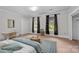 Bright bedroom features two windows with decorative curtains and a plush blue accent rug at 610 4Th St, Spencer, NC 28159