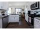 Open kitchen view with stainless appliances, granite counters, leading to dining area at 7607 Nolen Farm Dr, Gastonia, NC 28056