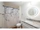 Bathroom featuring decorative shower curtain, modern vanity with granite counters and a vanity mirror at 123 23Rd Nw St # E, Hickory, NC 28601