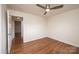 Bright bedroom features wood floors and a doorway leading to another room at 123 23Rd Nw St # E, Hickory, NC 28601