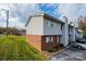 A street view of a brick and vinyl sided building with mature landscaping at 123 23Rd Nw St # E, Hickory, NC 28601