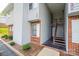 Exterior of a two-story condo building with brick accents, siding and landscaped entryway at 123 23Rd Nw St # E, Hickory, NC 28601