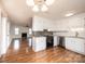 Bright kitchen features white cabinets, granite countertops and stainless-steel appliances at 123 23Rd Nw St # E, Hickory, NC 28601