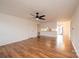 Spacious living room with wood-look flooring, fan, and fireplace at 123 23Rd Nw St # E, Hickory, NC 28601