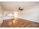 Spacious living area flows into the kitchen with wood-look flooring and neutral color palette at 123 23Rd Nw St # E, Hickory, NC 28601