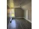 Bright bedroom featuring gray laminate floors and a window at 1808 Taylor Ave, Charlotte, NC 28216