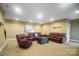 Spacious basement recreation area with comfortable leather furniture at 226 Hermance Ln, Mooresville, NC 28117