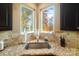 Kitchen corner sink with granite countertop and view to the lake at 226 Hermance Ln, Mooresville, NC 28117