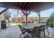 Covered patio with lake view, outdoor dining, and grill at 226 Hermance Ln, Mooresville, NC 28117