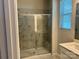 Modern bathroom with a glass-enclosed shower showcasing marble-like tiles and a convenient built-in bench at 2615 Tillman St, Monroe, NC 28112