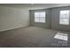 Spacious bedroom featuring plush carpet, neutral walls, and large windows offering plenty of natural light at 2615 Tillman St, Monroe, NC 28112