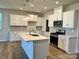 Beautiful kitchen featuring white cabinets, stainless steel appliances, granite countertops and a center island at 2615 Tillman St, Monroe, NC 28112