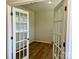 Inviting office space with glass French doors and wood flooring providing privacy and style to the workspace at 2615 Tillman St, Monroe, NC 28112
