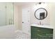 Updated bathroom with a green vanity, frameless shower, and patterned floor at 3804 Singletree Rd, Mint Hill, NC 28227