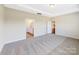 Bedroom with carpeted floors and a view into the Primary bathroom at 127 Jentri Way, Mooresville, NC 28115
