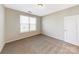 Cozy bedroom featuring a window for natural light and a convenient closet for storage at 127 Jentri Way, Mooresville, NC 28115