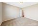 Bedroom with carpeted floors and view into the hallway at 127 Jentri Way, Mooresville, NC 28115