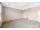 Bedroom with carpeted floors, tray ceiling, and bright natural light at 127 Jentri Way, Mooresville, NC 28115