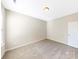 Inviting bedroom with neutral walls, carpet and ample space for relaxation and personalization at 127 Jentri Way, Mooresville, NC 28115