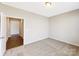 Bedroom with carpeted floors and a view into the hallway at 127 Jentri Way, Mooresville, NC 28115