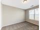 Bright bedroom with neutral walls and plush carpeting, ready for your personal touch at 127 Jentri Way, Mooresville, NC 28115