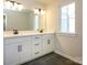 Bathroom with a double vanity, tile flooring, and natural light at 153 Halite Ln, Waxhaw, NC 28173