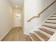 Bright entryway featuring wood-look flooring, a staircase with wooden treads, and a front door at 153 Halite Ln, Waxhaw, NC 28173