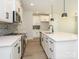 Contemporary kitchen with a large island, stainless appliances, and modern cabinetry at 153 Halite Ln, Waxhaw, NC 28173