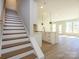 Open-concept kitchen and living area with a large island, stainless appliances and modern finishes at 153 Halite Ln, Waxhaw, NC 28173