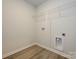 Convenient laundry room with laminate flooring, and washer/dryer hookups for easy chores at 153 Halite Ln, Waxhaw, NC 28173