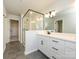 Primary bathroom featuring a glass shower, tile floors, and double vanity at 153 Halite Ln, Waxhaw, NC 28173