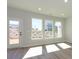 Bright sunroom features light wood floors, lots of natural light, a door, and many large windows with backyard views at 153 Halite Ln, Waxhaw, NC 28173
