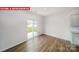 Dining area with sliding door to backyard and wood-look floors at 3861 Cullen Meadows Dr, Davidson, NC 28036