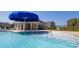 Community pool with a large umbrella and a shallow area for  at 3861 Cullen Meadows Dr, Davidson, NC 28036