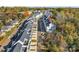 Aerial view showcases a row of modern townhomes with well-maintained landscaping and individual parking spaces at 582 West End Dr, Charlotte, NC 28208